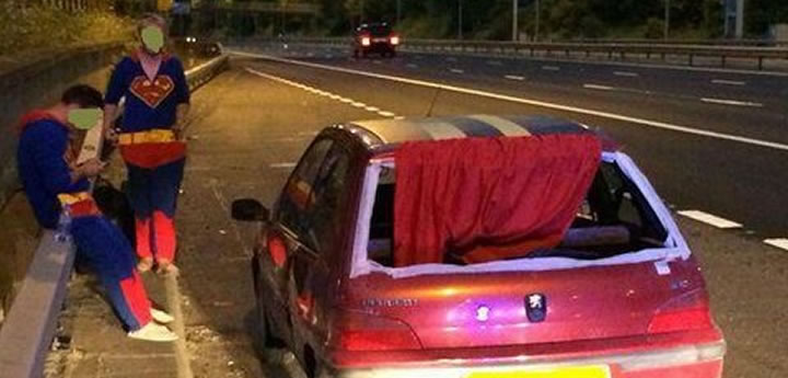 Supermen with red-caped car pulle dover by police