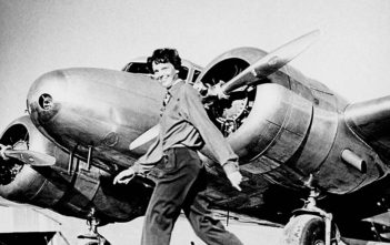 Amelia Earhart with a Lockhead Electra aircraft (1937)