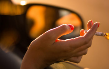 Smoking cigarette in car