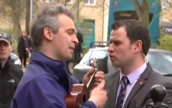 Busker tells Cameron to "fuck off back to Eton"