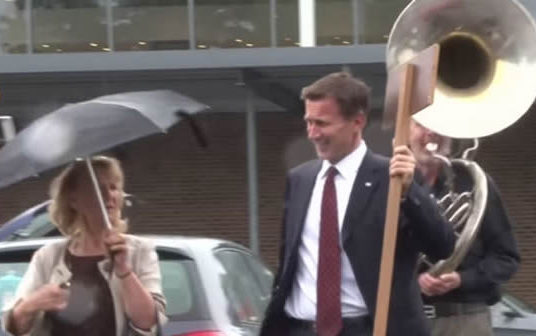 Jeremy Hunt trolled by a man playing a sousaphone