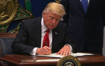 Donald Trump signs "Muslim ban" into law