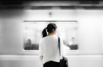Asian woman at a train station