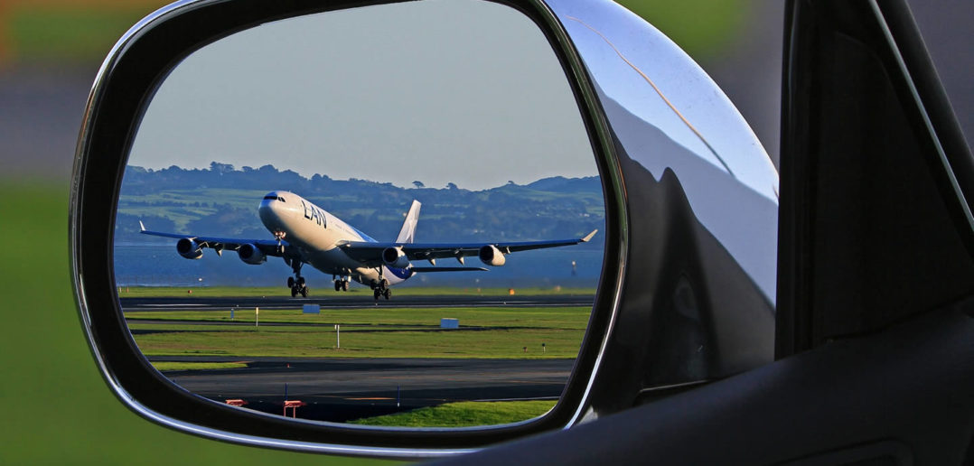 Aeroplane in car wing mirror