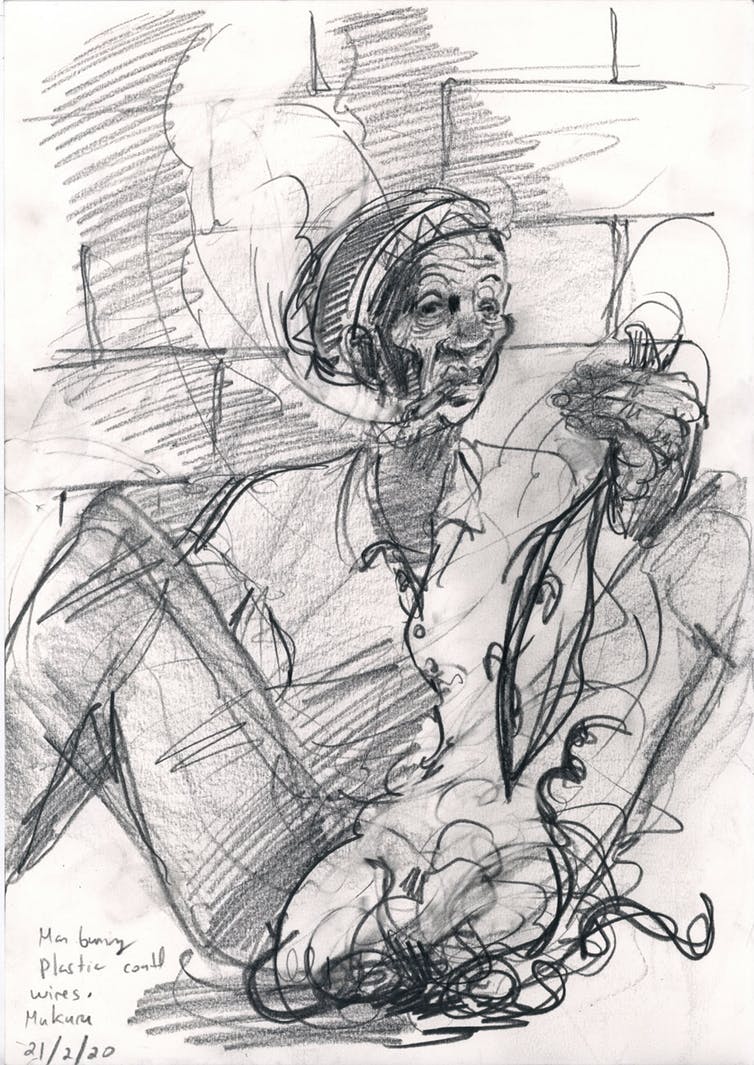 Man burning electrical wire, Mukuru, Nairobi. Louis Netter